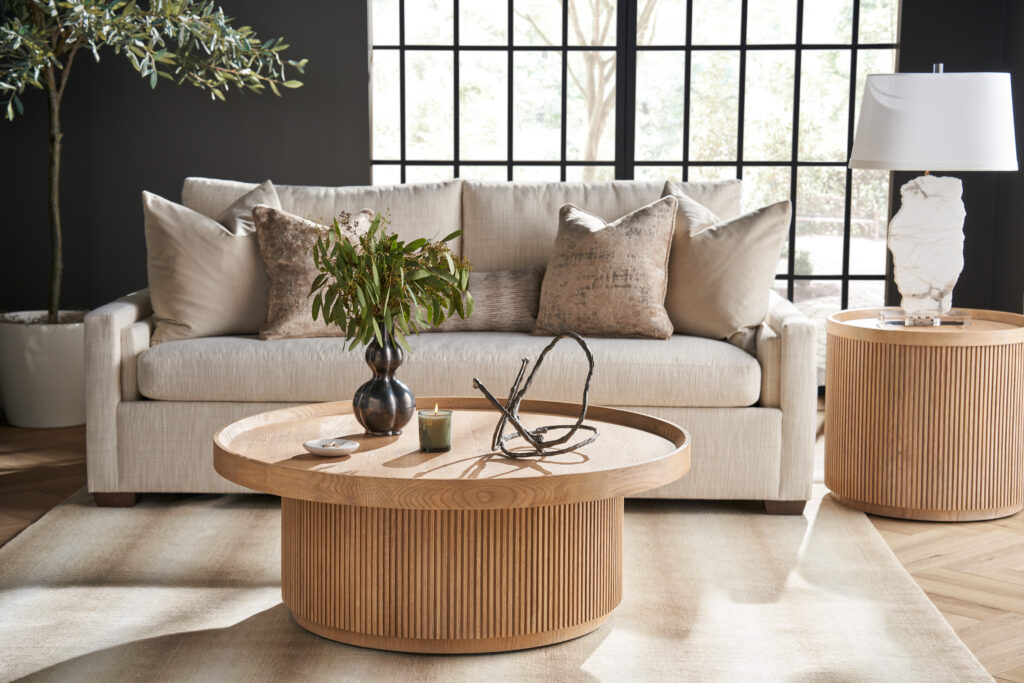 Light neutral Modern U Choose sofa with track arms, styled with an oak drum table and a fluted side table.